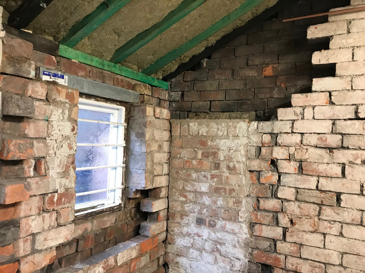 Some damp and loose brickwork Some damp and loose brickwork